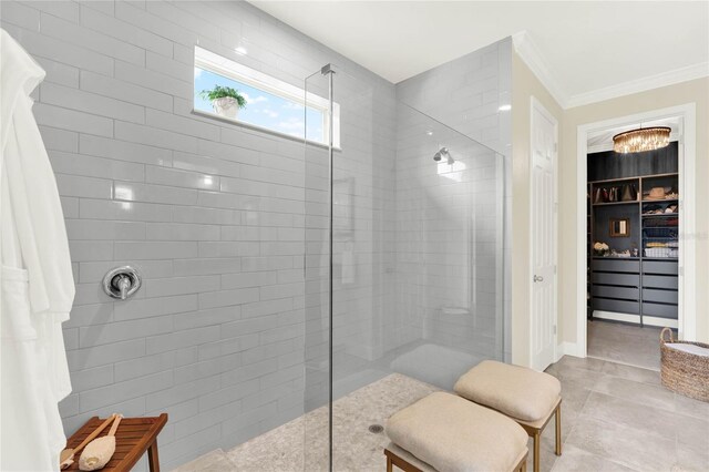 bathroom with a walk in shower, ornamental molding, a closet, and tile patterned flooring