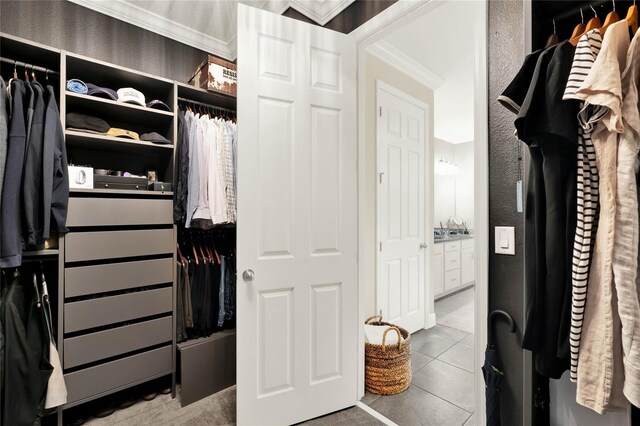 walk in closet featuring tile patterned flooring