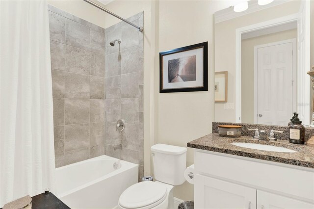 bathroom with toilet, shower / bath combo, and vanity