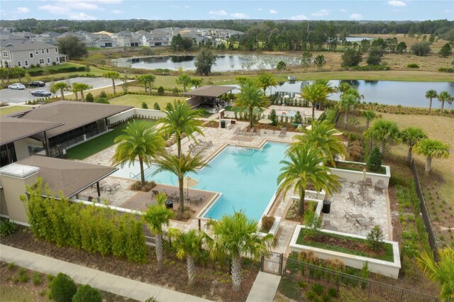 drone / aerial view with a water view and a residential view