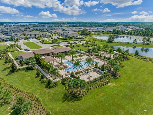 bird's eye view featuring a water view and a residential view