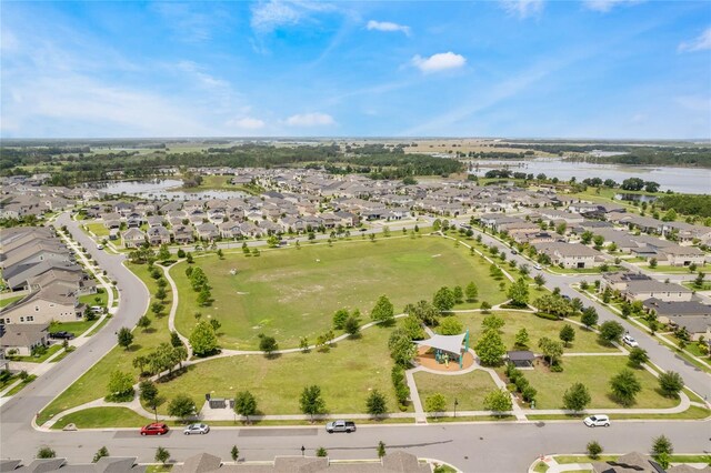 bird's eye view with a residential view and a water view