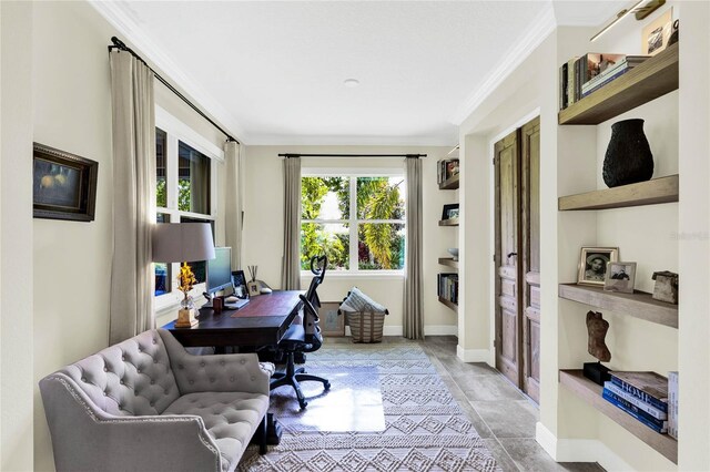 office area with ornamental molding and baseboards