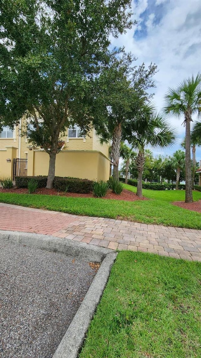 view of side of home featuring a lawn