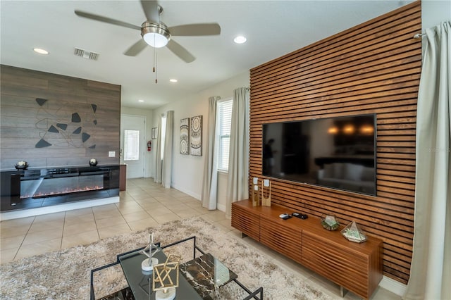 tiled living room with ceiling fan