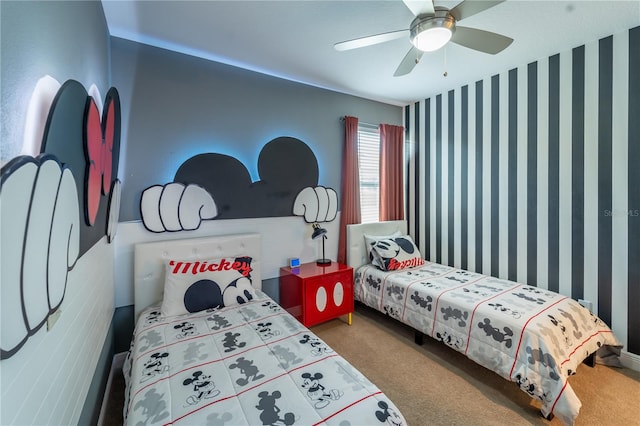 bedroom featuring ceiling fan and carpet