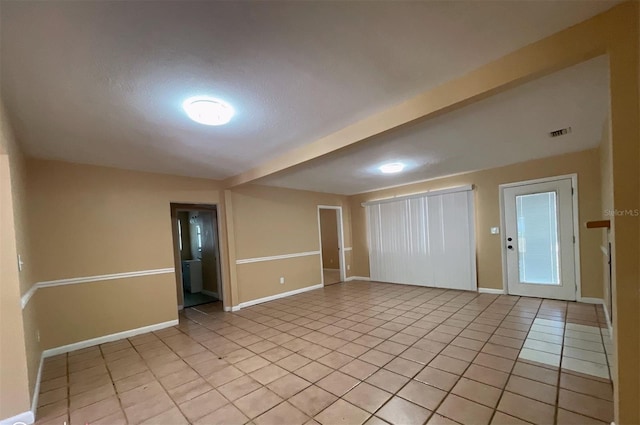 view of tiled spare room