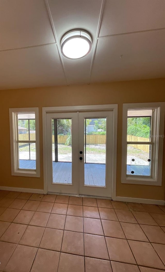 doorway featuring french doors and light tile patterned floors