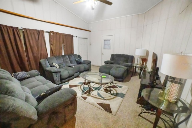 living room with vaulted ceiling, carpet floors, and ceiling fan