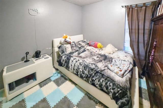 bedroom featuring a textured ceiling