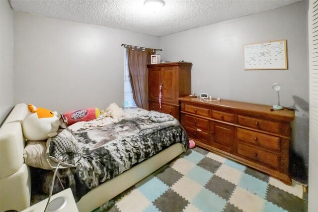 bedroom with a textured ceiling