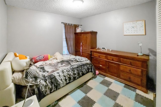 bedroom featuring a textured ceiling