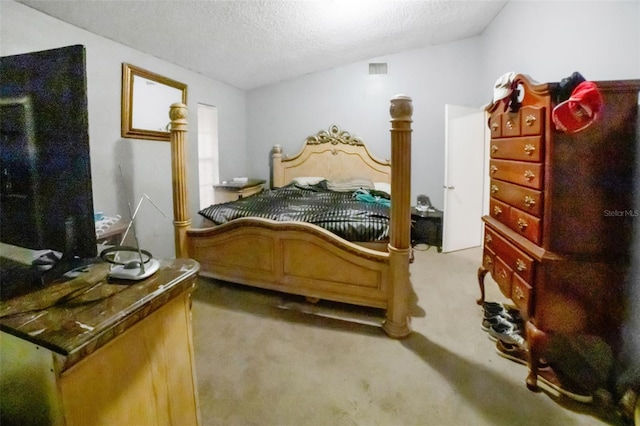 carpeted bedroom with a textured ceiling