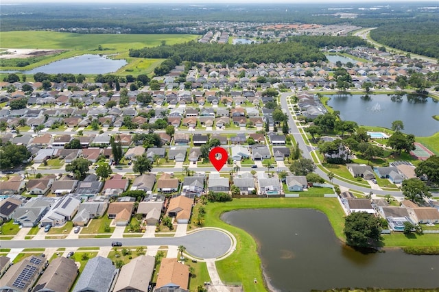 bird's eye view featuring a residential view and a water view