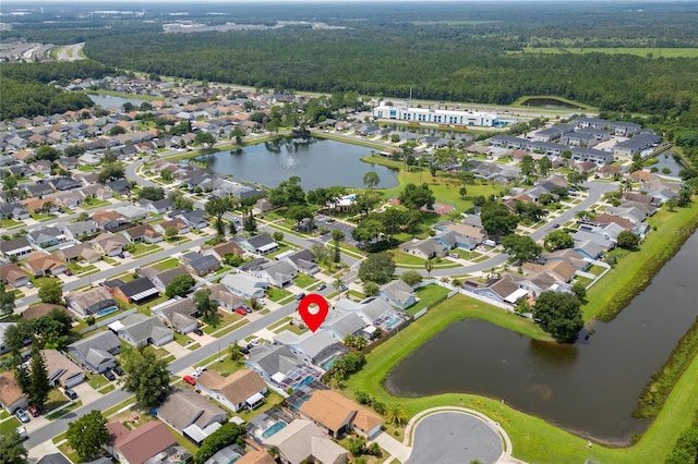 aerial view with a water view, a residential view, and a view of trees