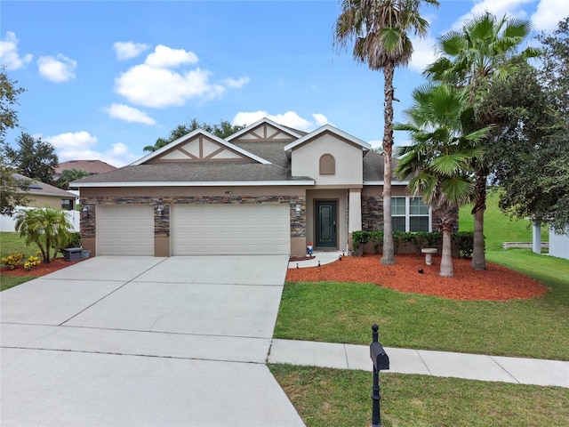 view of front of house with a front lawn and a garage