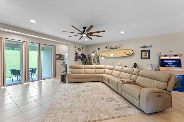 living room featuring light tile patterned floors and ceiling fan