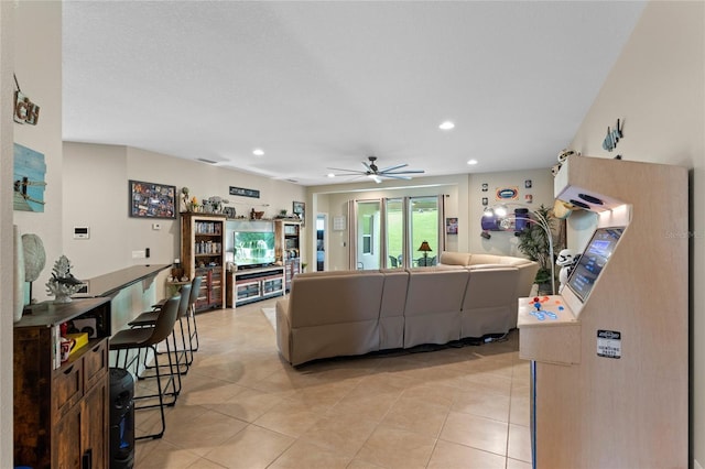 tiled living room featuring ceiling fan