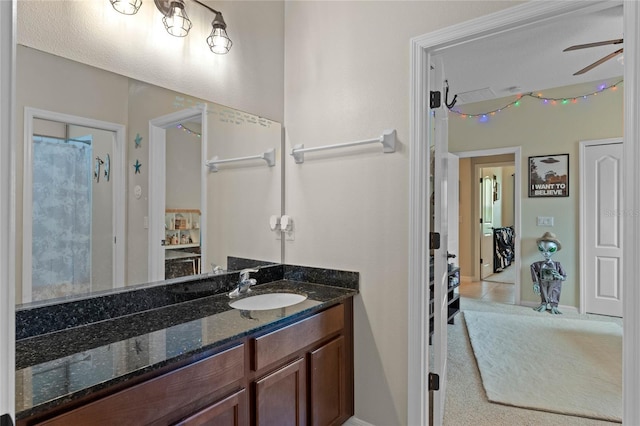 bathroom with ceiling fan and vanity