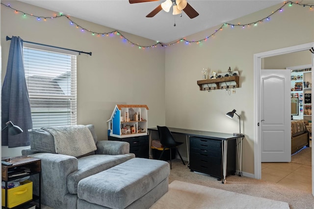 interior space featuring light carpet and ceiling fan