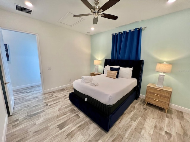 bedroom featuring light hardwood / wood-style flooring and ceiling fan