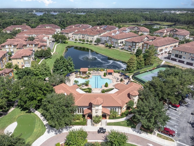 drone / aerial view with a residential view and a water view