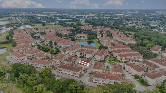 birds eye view of property featuring a residential view and a water view