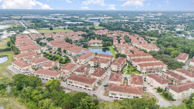 bird's eye view featuring a residential view and a water view