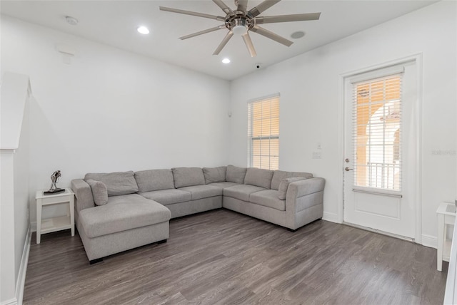 living area with ceiling fan, baseboards, wood finished floors, and recessed lighting