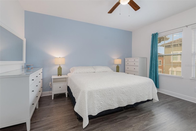 bedroom featuring dark wood-style floors, baseboards, and a ceiling fan