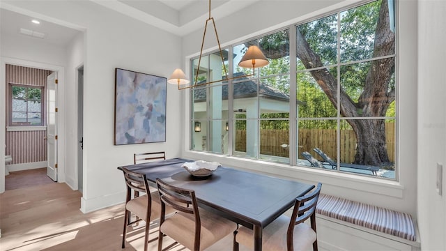 dining area featuring recessed lighting, wood finished floors, and baseboards