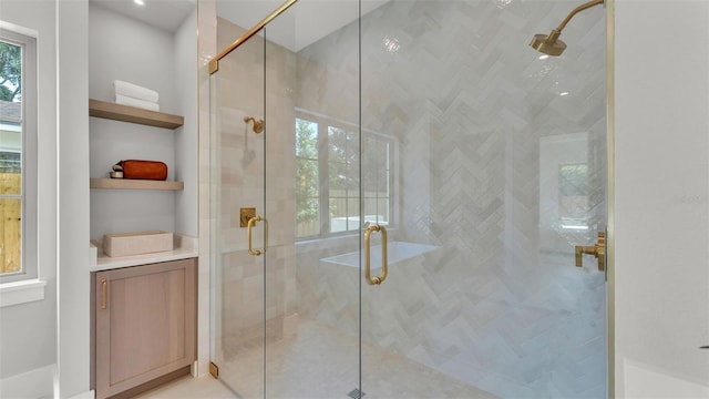 bathroom with a healthy amount of sunlight and a stall shower