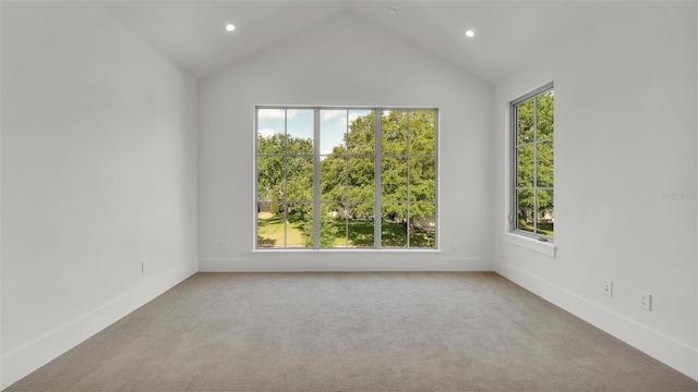 unfurnished room with baseboards, recessed lighting, lofted ceiling, and carpet