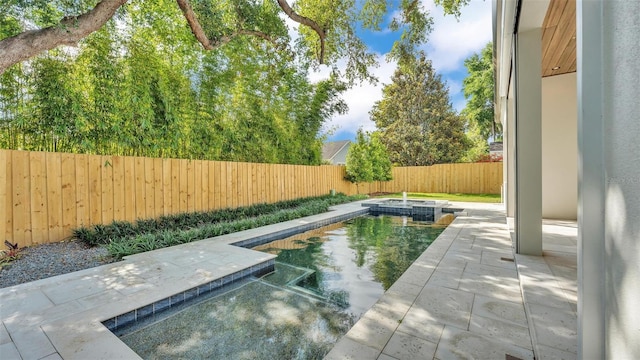 view of swimming pool with a fenced backyard, a hot tub, a fenced in pool, and a patio area