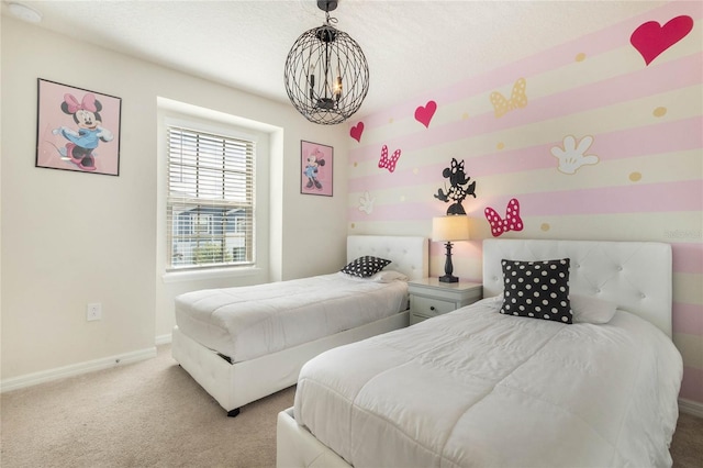 bedroom featuring baseboards, a textured ceiling, a chandelier, and light colored carpet