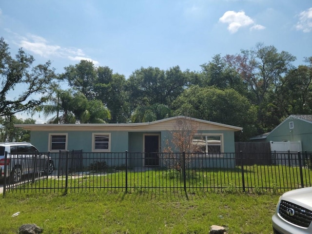 view of front of property featuring central AC unit and a front yard