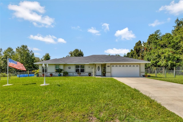 single story home featuring a garage and a front lawn