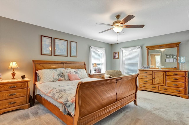 10604 SE 146th Ln, Summerfield, FL 34491 - bedroom featuring light colored carpet and a ceiling fan