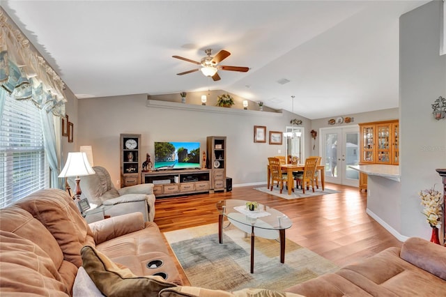 living room with french doors, plenty of natural light, light hardwood / wood-style flooring, and ceiling fan