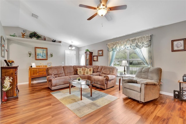 10604 SE 146th Ln, Summerfield, FL 34491 - living area featuring visible vents, baseboards, lofted ceiling, and light wood-style floors