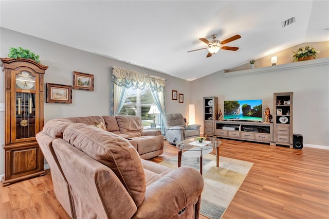 living room featuring lofted ceiling, ceiling fan, and light hardwood / wood-style floors