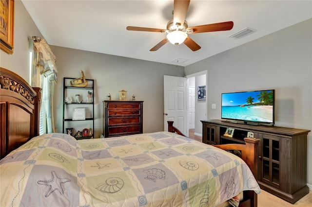 bedroom featuring light colored carpet and ceiling fan