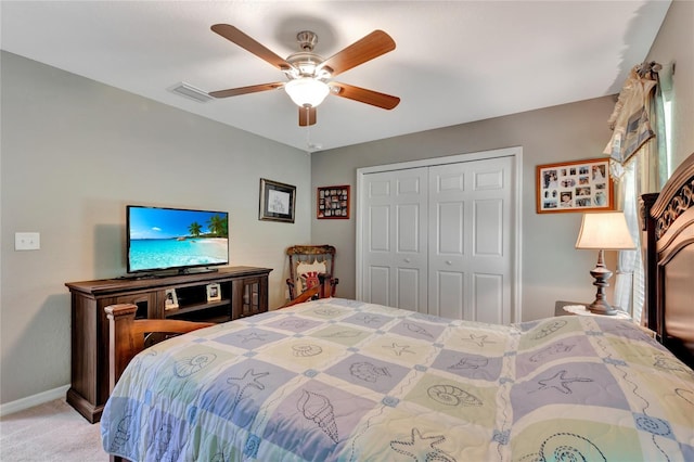 10604 SE 146th Ln, Summerfield, FL 34491 - bedroom featuring visible vents, baseboards, ceiling fan, light carpet, and a closet