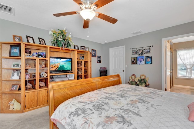 10604 SE 146th Ln, Summerfield, FL 34491 - bedroom with visible vents, light colored carpet, and ceiling fan