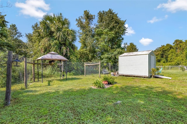10604 SE 146th Ln, Summerfield, FL 34491 - view of yard featuring a fenced backyard, a gazebo, a storage shed, and an outdoor structure