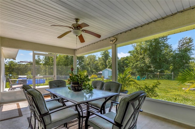 sunroom / solarium with ceiling fan