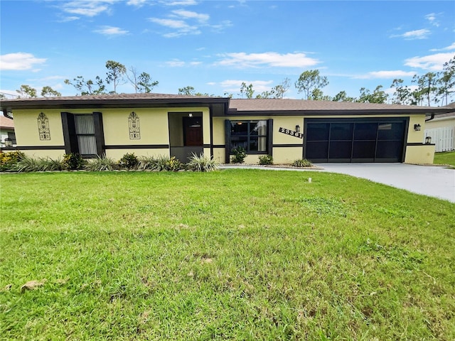 ranch-style home with a front yard and a garage