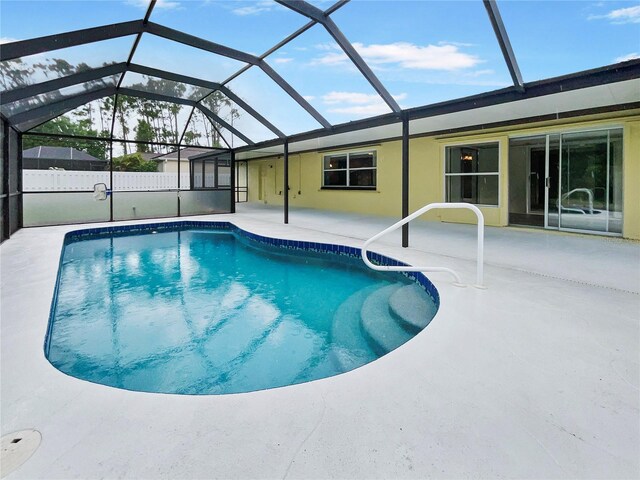 view of pool with a fenced in pool, a lanai, and a patio area