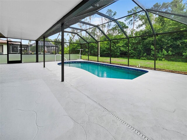 outdoor pool featuring a patio, a lawn, and a lanai