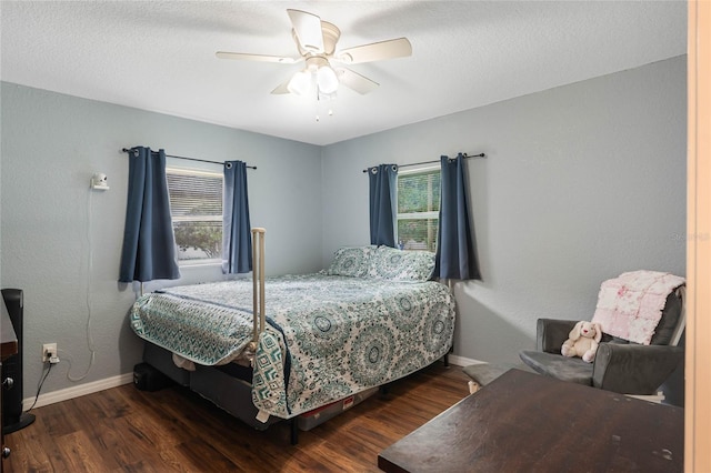 bedroom featuring a ceiling fan, baseboards, and wood finished floors